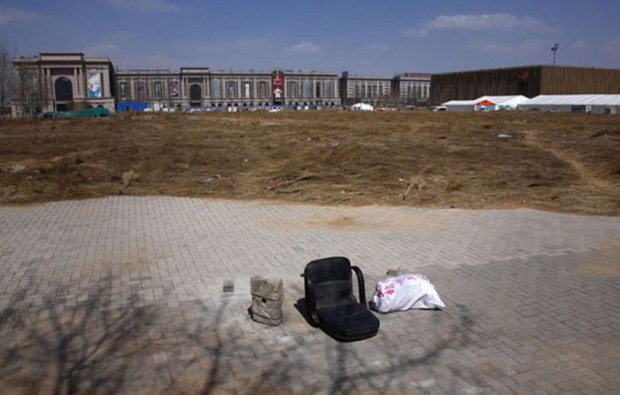 A chair lies on a deserted field that was once part of the stadium where the 2008 Olympic Games baseball competition was held in central Beijing